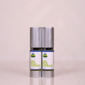 A couple of bottles of cbd oil on top of each other.