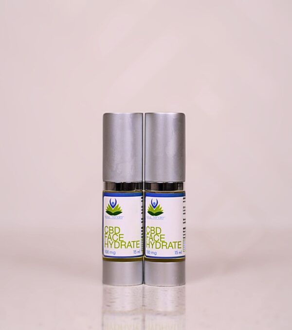 A couple of bottles of cbd oil on top of each other.